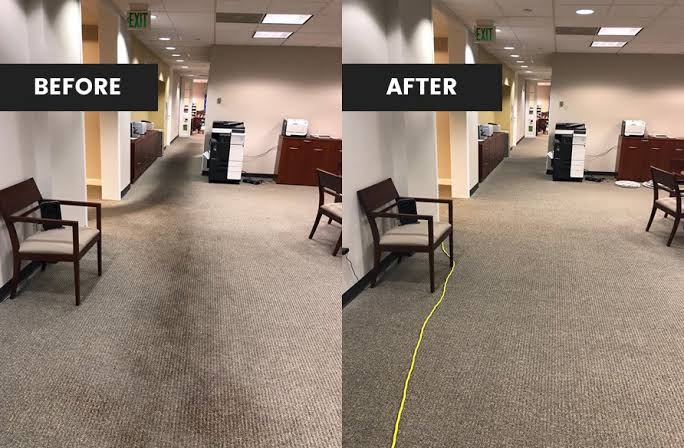 Before and after: Office corridor — carpet extraction. A traffic lane worn dark down the centre of the corridor — the classic pattern where soil is ground into the pile rather than sitting on it. Pre-treated, agitated and hot-water extracted back to the original colour.